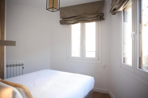 Una cama o camas en una habitación de Apartamentos Telecabine 365
