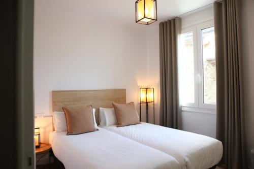 Una cama o camas en una habitación de Apartamentos Telecabine 365