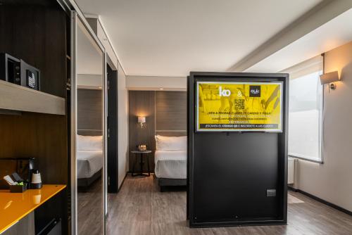 a hotel room with a sign in a room at Ola Santiago Providencia, Tapestry Collection by Hilton in Santiago
