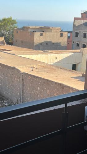 una ventana de un edificio con vistas en Appartement 3 vue sur mer, en Tamraght Ou Fella