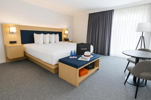 a hotel room with a bed and a table at The Live Hotel in Los Angeles