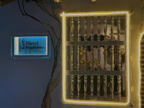 a box filled with figurines next to a wall at Hotel La Magdalena in Cartagena de Indias