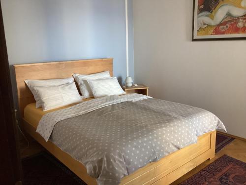 a bedroom with a bed with white pillows at Die Appartements Glavas mit Loggia und Balkon für 3 Personen in Novi Vinodolski