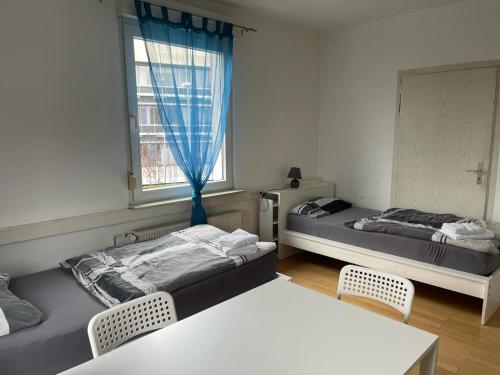 Postel nebo postele na pokoji v ubytování Boardinghouse Behrend I