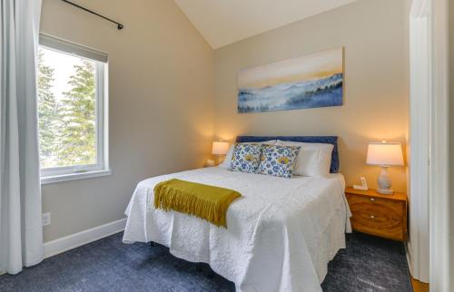 a bedroom with a bed and a window at Scenic and Cozy Sweet Northern Comfort in Homer! in Homer