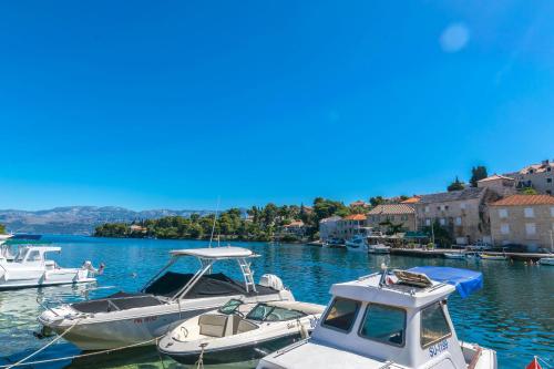 a group of boats are docked in a harbor at Apartment New in Splitska