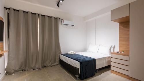 Postel nebo postele na pokoji v ubytování Alto Madalena - Studios de luxo com piscina panorâmica