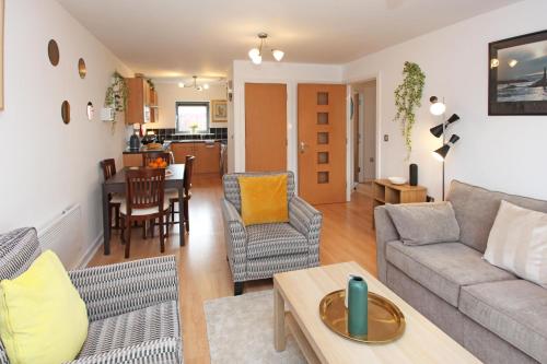 a living room with a couch and a table at Albion Street Apartments in Wolverhampton