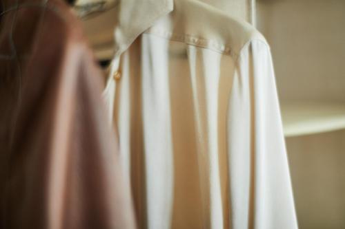 a white shirt is hanging on a shelf at Locanda Ca' Matilde in Quattro Castella