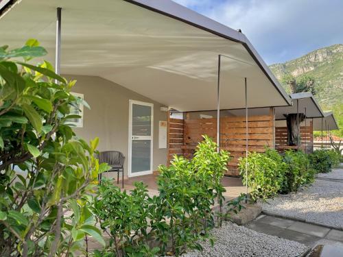 a house with a covered porch with a patio at Sopramare Resort in Piano di Sorrento