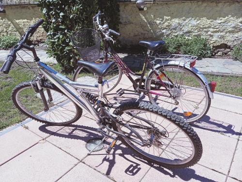 a bike parked on a sidewalk next to another bike at A casa di 'Nuccia' in Foglizzo