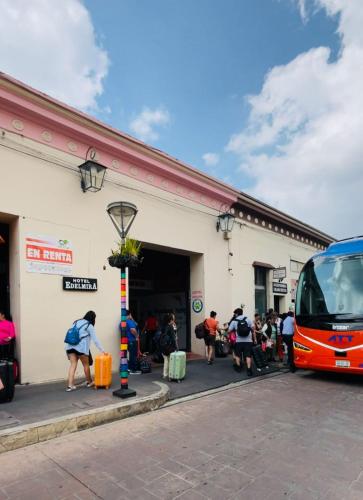 a bus parked in front of a building at HOTEL EDELMIRA in Comitán de Domínguez