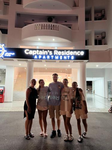 a group of people standing in front of a store at CAPTAIN'S RESIDENCE in Ksamil