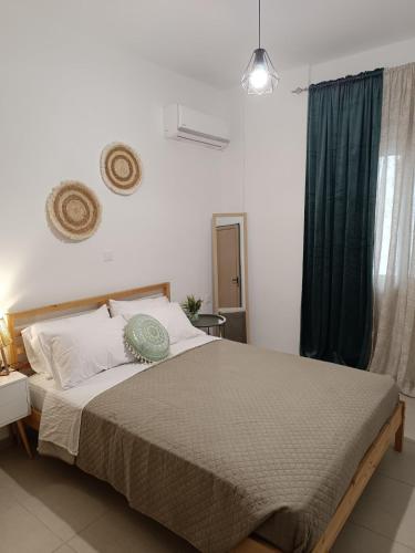 Postel nebo postele na pokoji v ubytování Tatti's Apartment