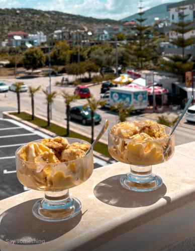 two bowls of ice cream sitting on a ledge at CAPTAIN'S RESIDENCE in Ksamil