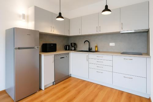 Dapur atau dapur kecil di Peninsula Apartment