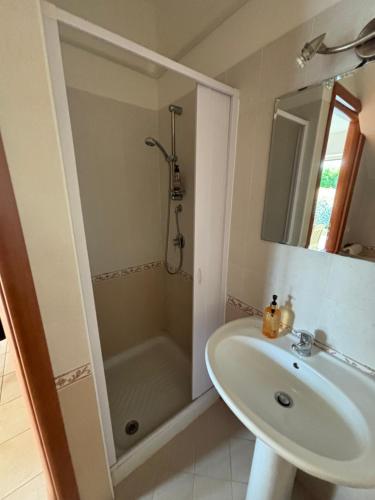 a bathroom with a sink and a shower at South Italy summer house in Stazione di San Sostene
