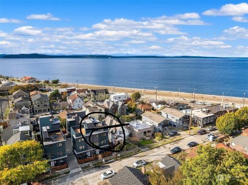 an aerial view of a city and a beach at Alki Beach Front TownHome in Seattle
