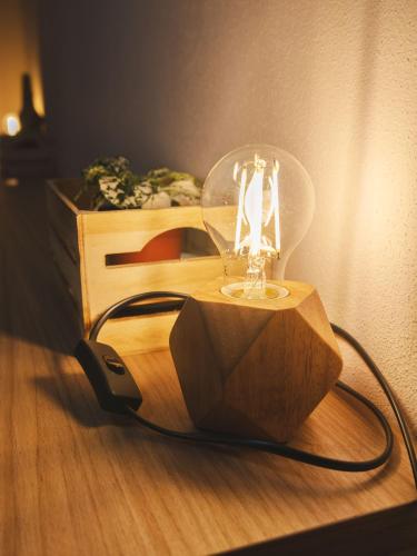 a lamp sitting on top of a wooden table at Agriturismo Camponovo in Brisighella