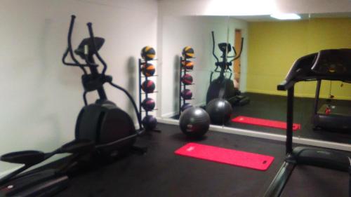 a gym with several exercise equipment in a room at Days Inn by Wyndham Cleveland Lakewood in Lakewood