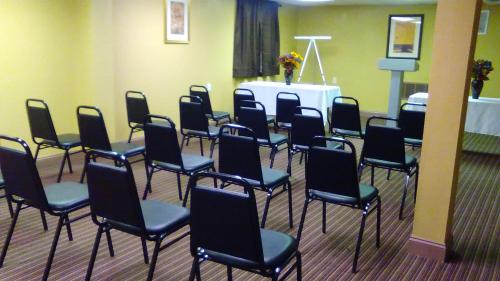 a group of chairs in a room at Days Inn by Wyndham Cleveland Lakewood in Lakewood