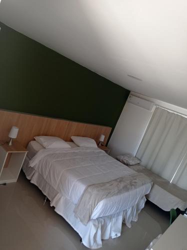 PLC Hotel Centenarioにあるベッド