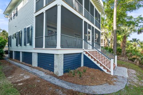 a house with a porch and a balcony at Fripp Island 94 Davis Love Dr in Fripp Island