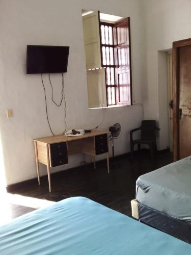 Letto o letti in una camera di Hotel Pelman