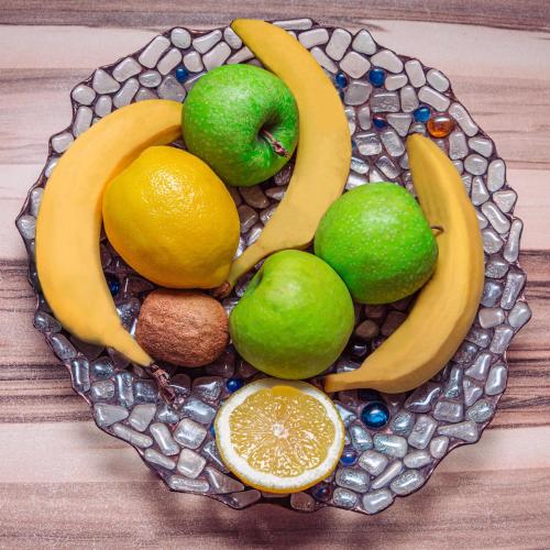 a plate filled with different types of fruit at Tequila Sunrise Hostel Sydney in Sydney