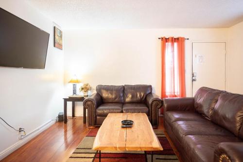 a living room with a couch and a coffee table at 2 bedroom UNLV, Thomas Mack in Las Vegas