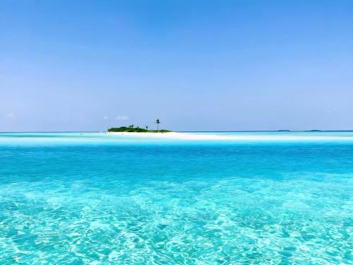 an island in the middle of a body of water at Aquatic Mathiveri in Mathiveri