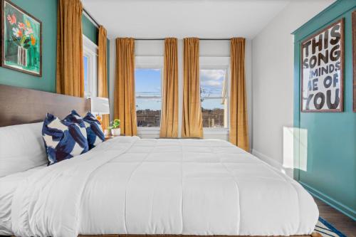 a large white bed in a room with a window at Royal Flush-6 King Beds-18 Mi To Mohegan in Norwich