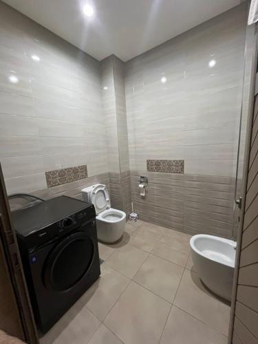 a bathroom with a toilet and a sink at Villa iligh in Agadir