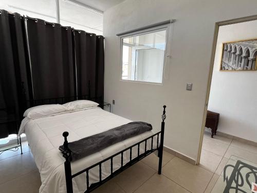 Postel nebo postele na pokoji v ubytování Hotel San Nicolás