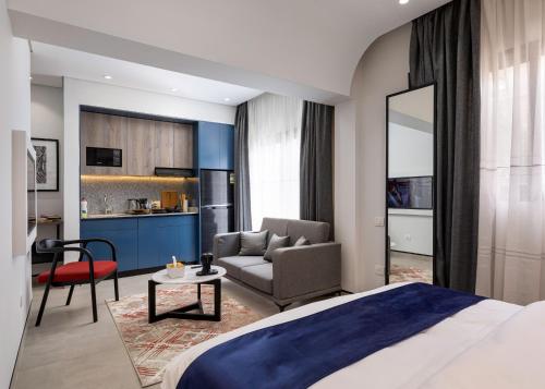 a bedroom with a bed and a living room at 22 by spacey #44-Studio in Maadi in Cairo
