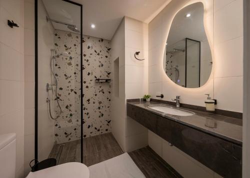a bathroom with a sink and a mirror at Exclusive stay with luxury touches at 22 by spacey #55 Studio in Maadi in Cairo