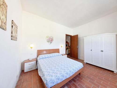 a bedroom with a bed and a dresser at Villa with private pool in Floridia