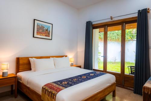 Ένα ή περισσότερα κρεβάτια σε δωμάτιο στο Madilao Hotel