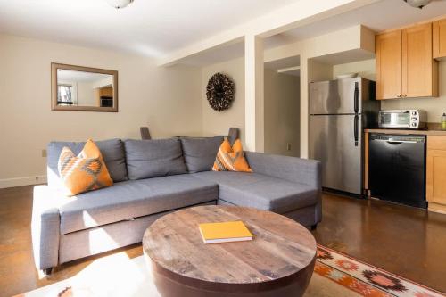 a living room with a couch and a table at Stay Portland - Joshua Tree Vibes in SE PDX - Local Bars & Food in Portland