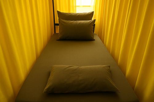 Postel nebo postele na pokoji v ubytování Non Pakse Hostel