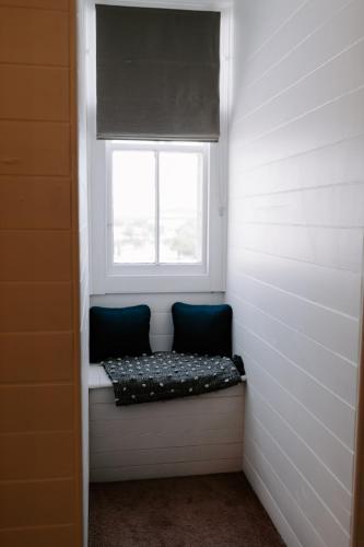 a window in a room with a bench under it at The Abbey in Warwick
