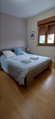 a bedroom with a large bed in a room at Vista marina VUT-7215-AS in Bañugues