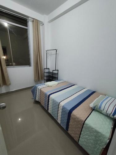 Ένα ή περισσότερα κρεβάτια σε δωμάτιο στο Beautiful Apartment in Tarapoto