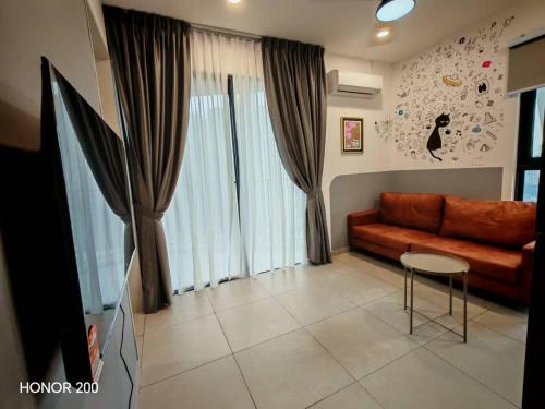 a living room with a couch and a table at Cozy 2BR Getaway for 3 YOLO in Petaling Jaya