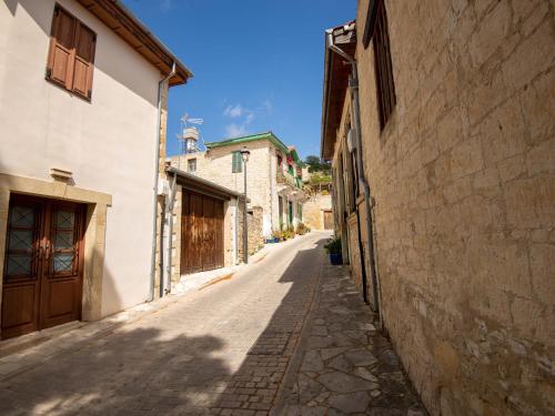 an alley in an old town with buildings at Sanders Arsorama Arsos in Arsos