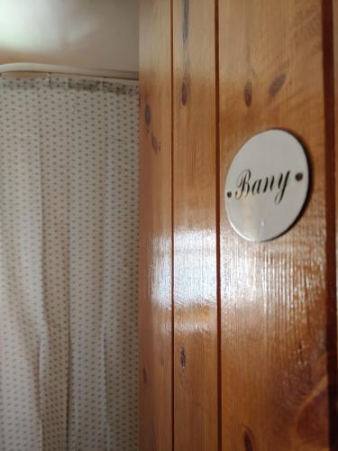 a bathroom door with a benny sign on it at Casa rural entera en Parque Natural de los Puertos in Alfara de Carles