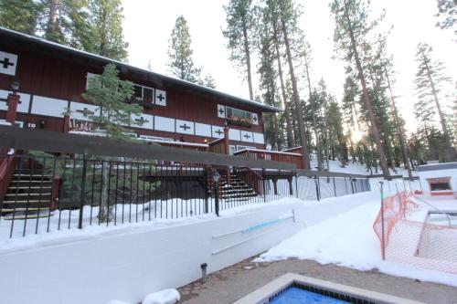 a building with a swimming pool in the snow at HCC0612 - Sitzmark Ski Condo townhouse in South Lake Tahoe