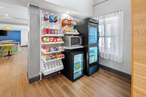 a refrigerator filled with lots of food at Spark By Hilton Woodbridge in Woodbridge