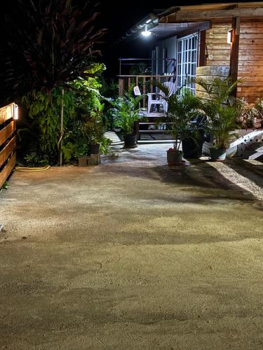 a patio at night with a bunch of plants at Maroe Bay Lodge in HUH
