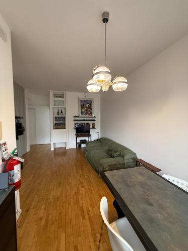 a living room with a couch and a table at Vintage Apartment in Vittorio Veneto